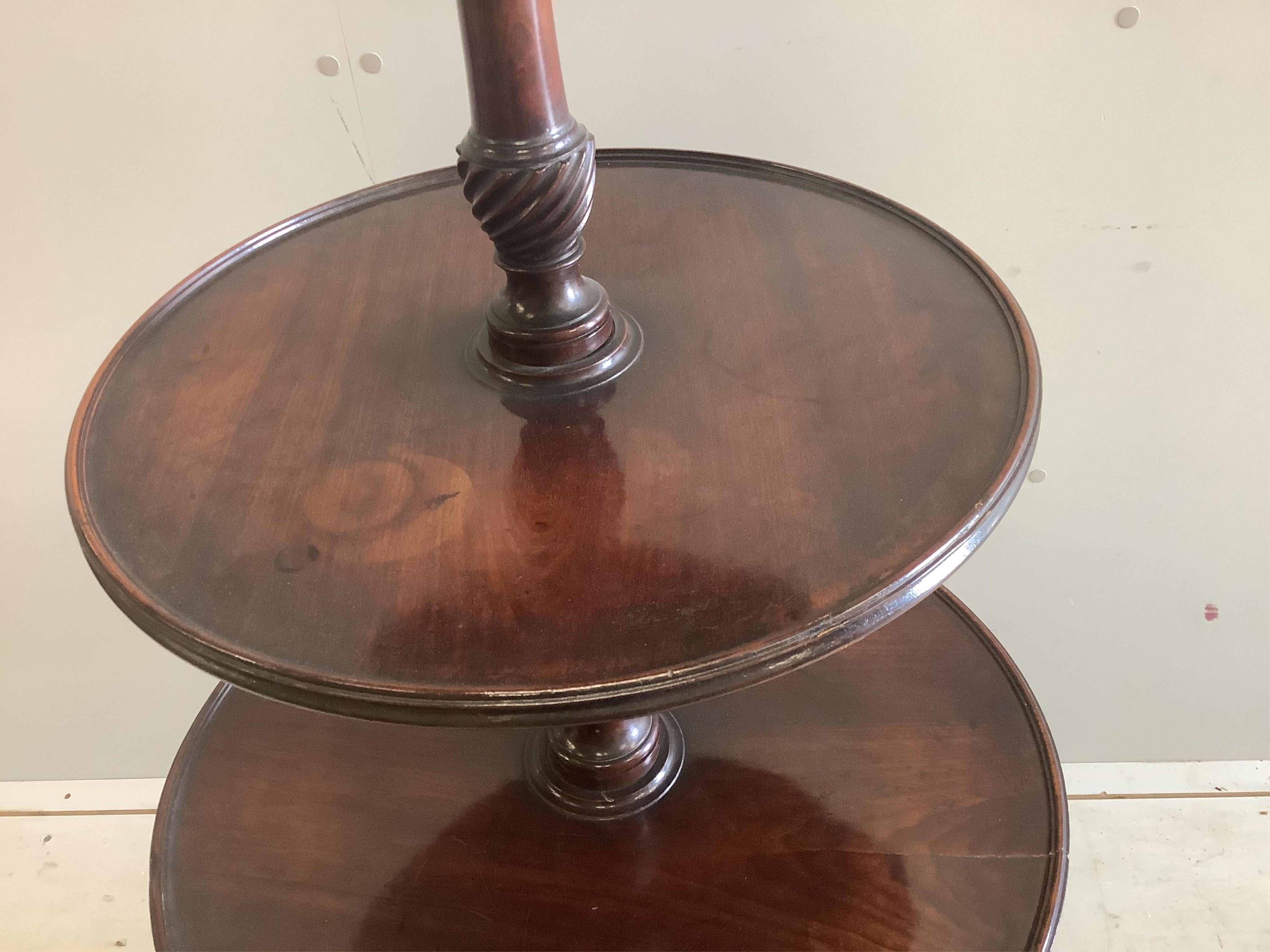 An early 19th century mahogany three tier dumb waiter, diameter 62cm, height 120cm